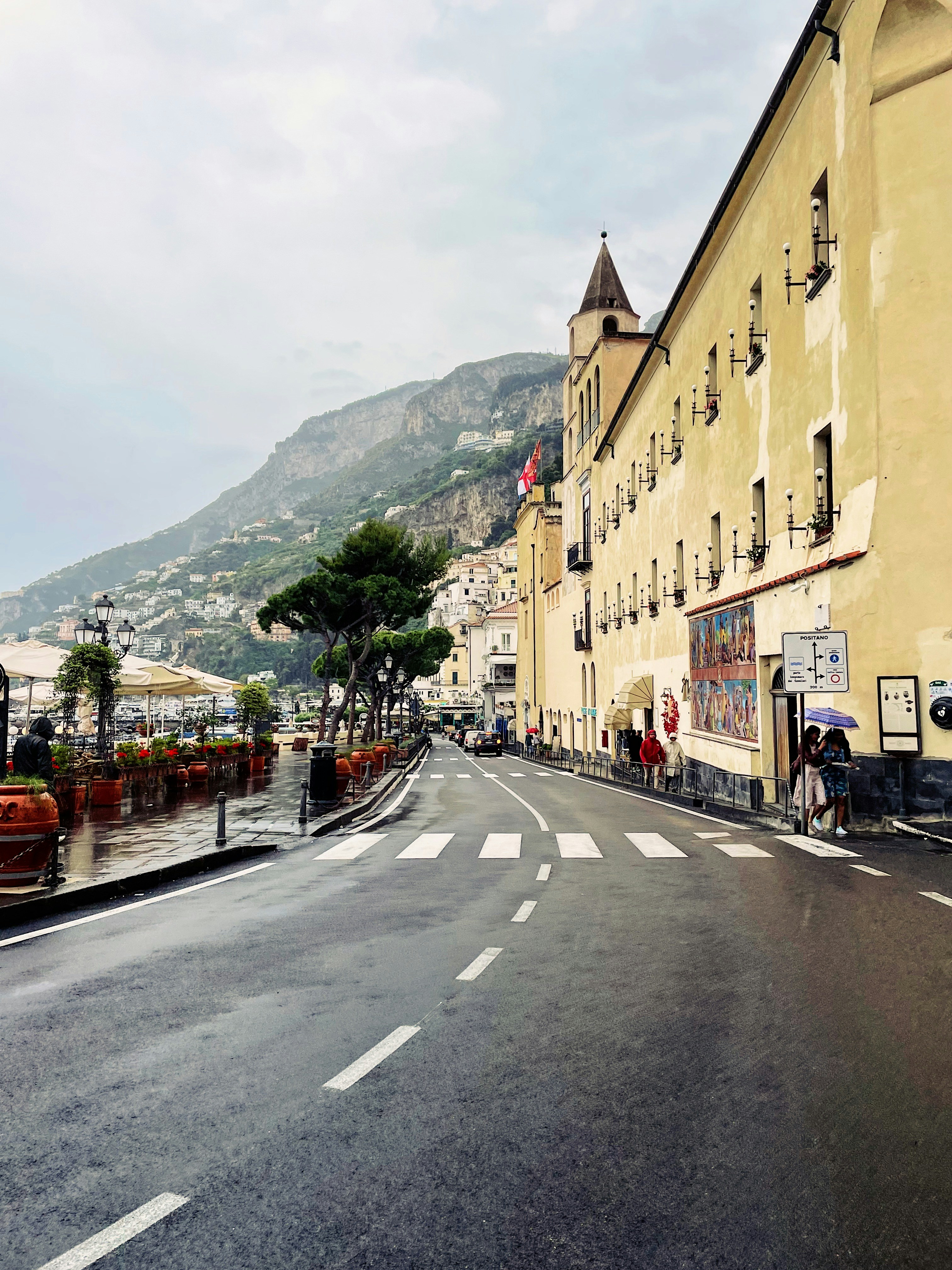 A quiet rain-slicked street along the Amalfi coastline